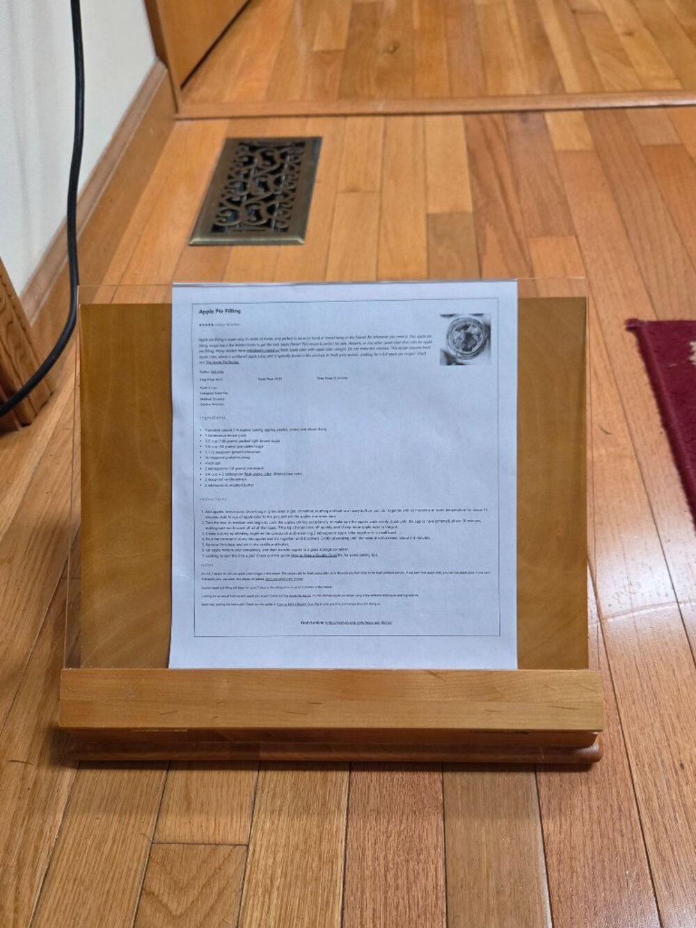 wooden cookbook stand with adjustable slant and an acrylic glass viewing shield